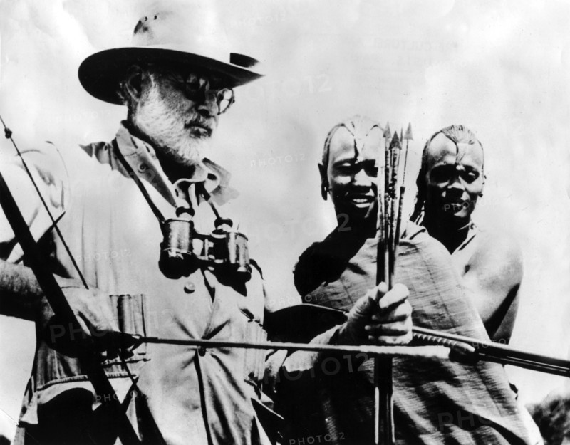 Ernest Hemingway testing an African bow