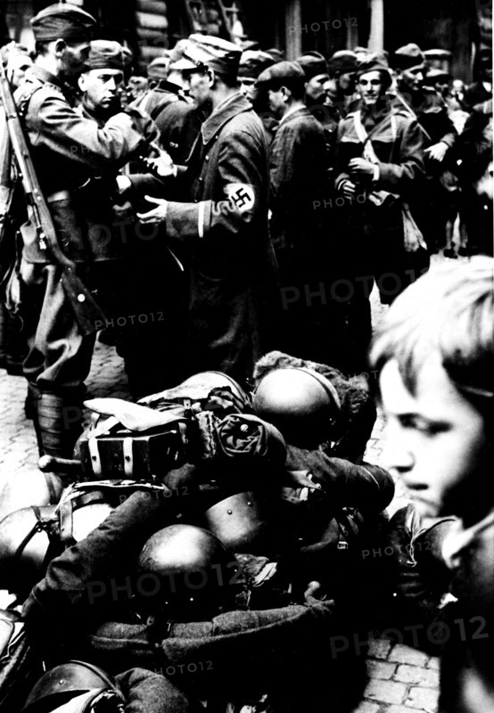 In a village of the Sudetes, Czech troops are waiting for the relief German troops