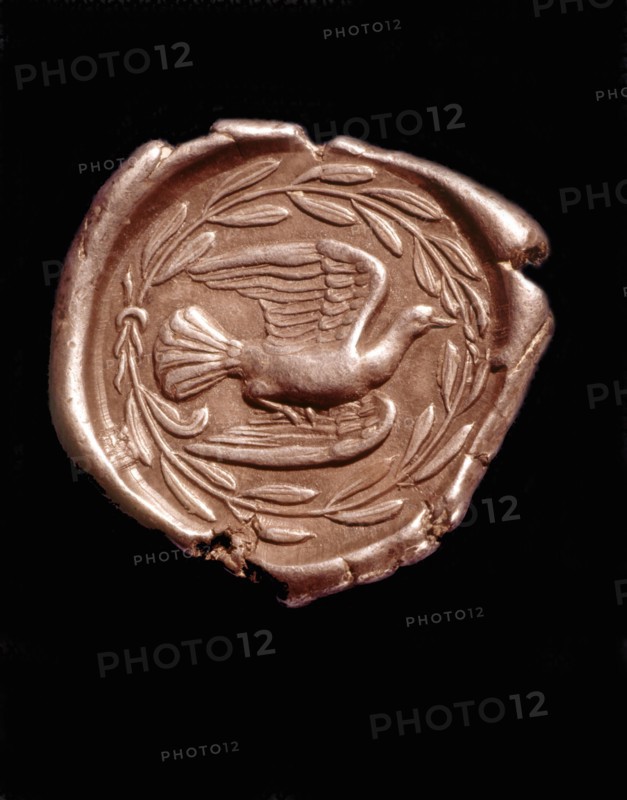 Revers d'une monnaie en argent figurant une colombe dans une couronne de laurier