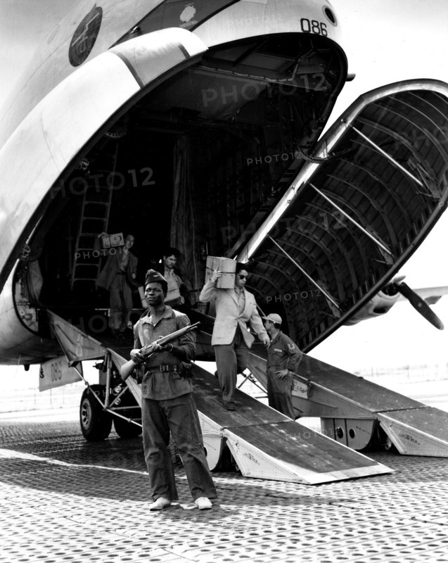 At an airport in Indochina, French personnel getting off a 'Globemaster' (1954)