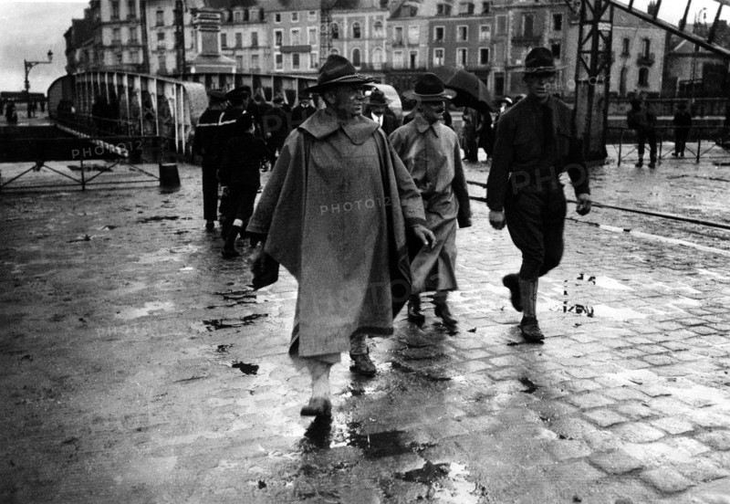 American soldiers walking in the rain near the Saint Nazaire harbour, France