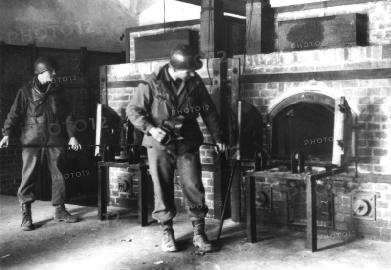 American soldiers by the crematory ovens of Dachau concentration camp