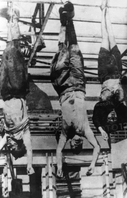 Milan. Mussolini hanging with his mistress Petacci in a public square
