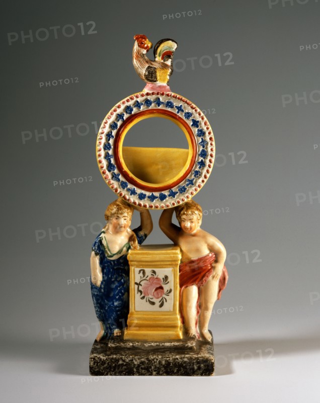 Watch holder with putti and a rooster on the top