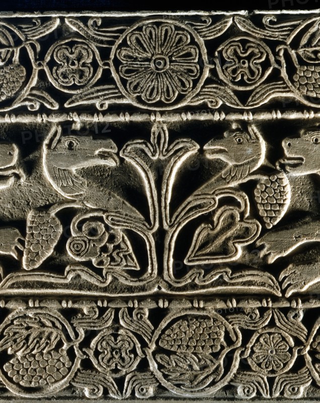 Animals facing each other around the tree of life (detail)