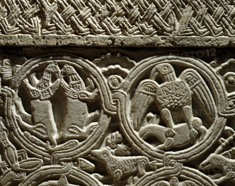 Griffons back to back and eagle holding a lamb