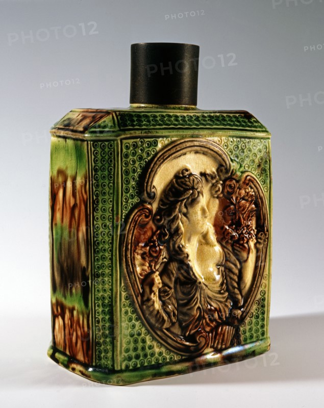 Green and brown tea caddy decorated with Flora figure