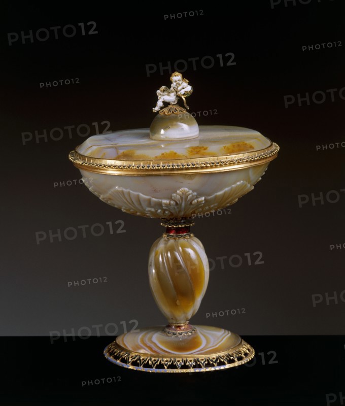 Cup and lid with Cupid statuette