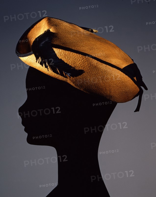 Oriental straw hat with gros-grain ribbon trim and eagle feather
