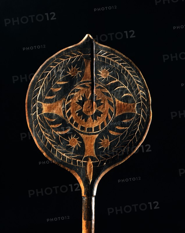 Carved canoe paddle