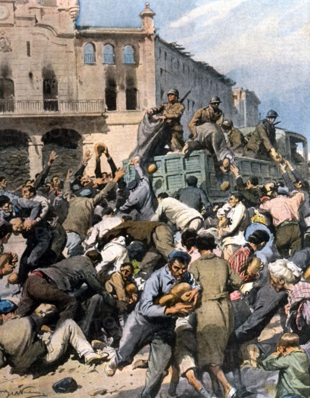 Guerre civile espagnole. Dès leur entrée à Bilbao, où le pain et l'eau manquaient depuis plusieurs jours, les libérateurs ont distribué des milliers de pains à la population affamée (1937)