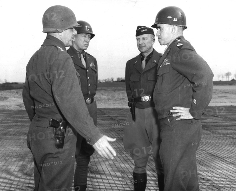 U.S Generals confer on a German airfield (March 20, 1945)
