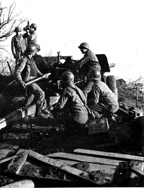 U.S tank destroyer unit  fires while Army Photographers film the action near Dillinger (Fall 1944)