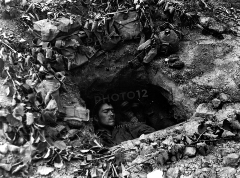 Time out in foxhole in France , July 11,1944