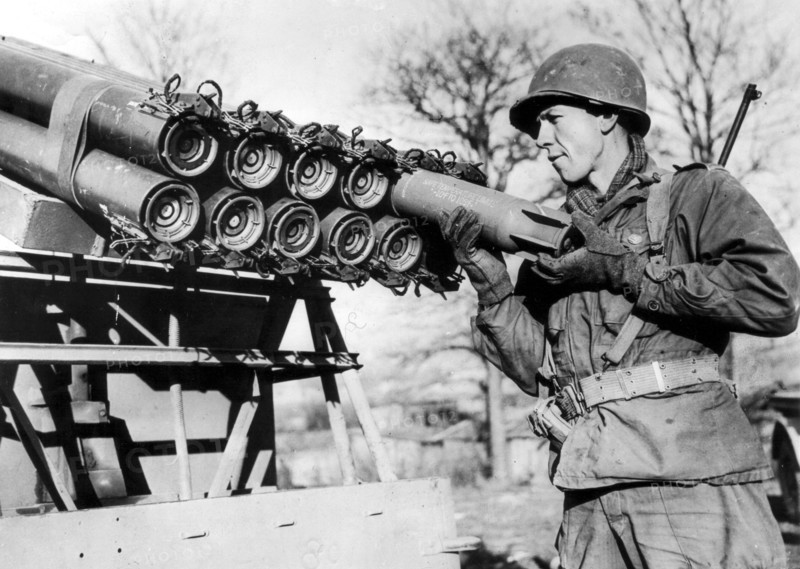 A U.S soldier loads a rocket shell into a launcher mouted on a jeep in the 7th U.S Army sector in  France, December 27,1944