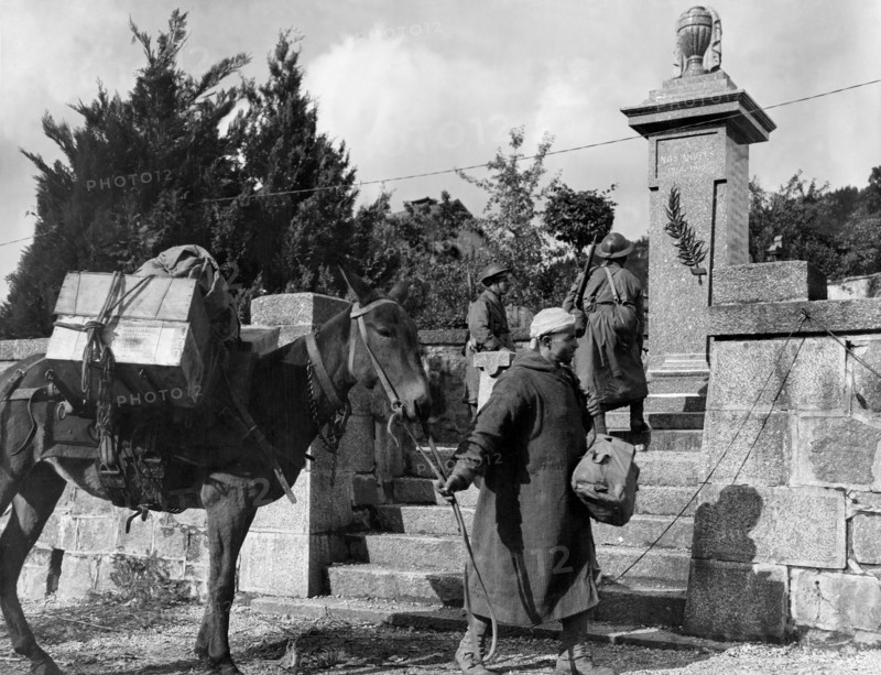 French goumiers in front of World War I memorial in Planois (France), Oct.24, 1944