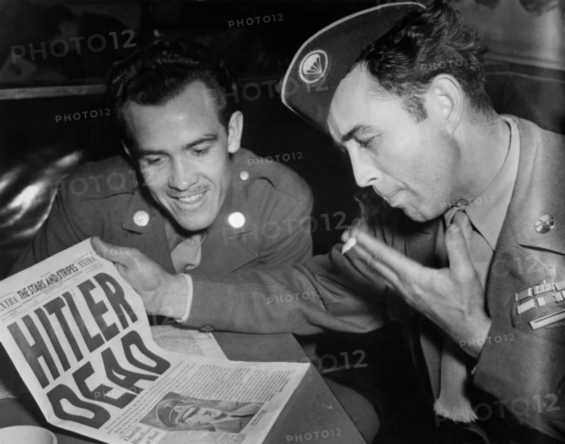 U.S.  soldiers read the Death of Hitler in Stars and Stripes Newspapers in Paris, May 2, 1944