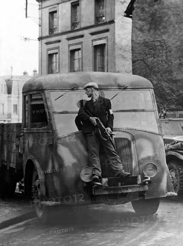 A French F.F.I. takes cover in Dreux (France) August 19, 1944
