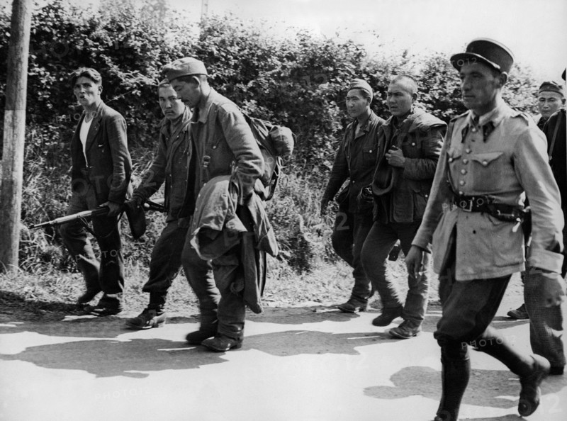 French patriots guard German prisoners near Avranches (France) Summer 1944