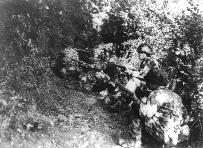 U.S. soldiers ready for action near  Pont Brocard, Summer 1944