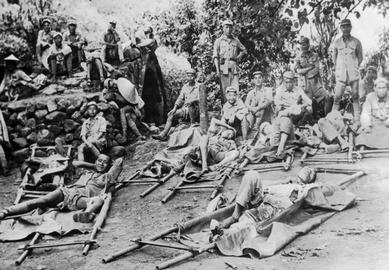 Chinese wounded rest on way to hospital  in the Salween river area, 1944