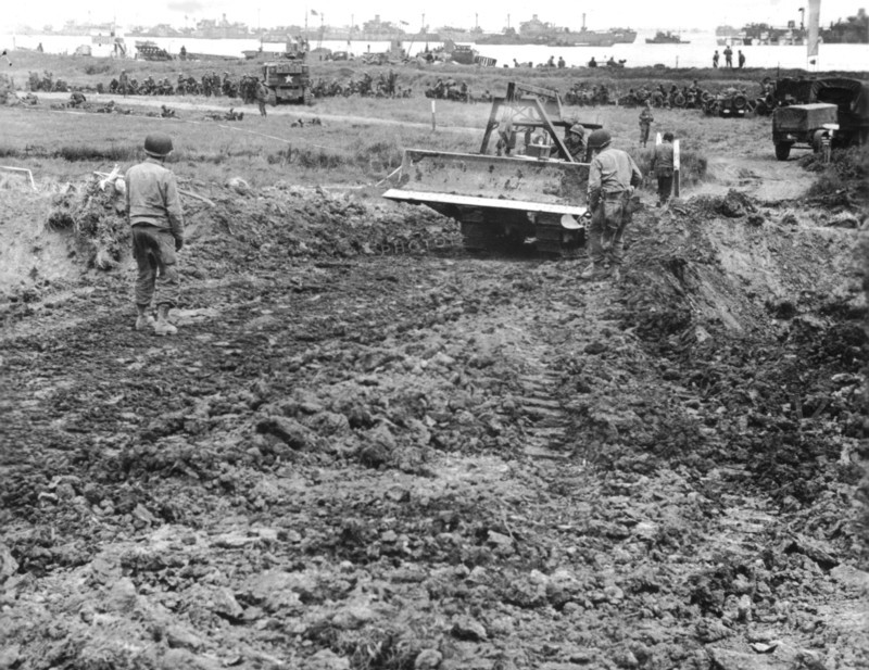 American soldiers build supply road on Normandy beachhead, June 1944