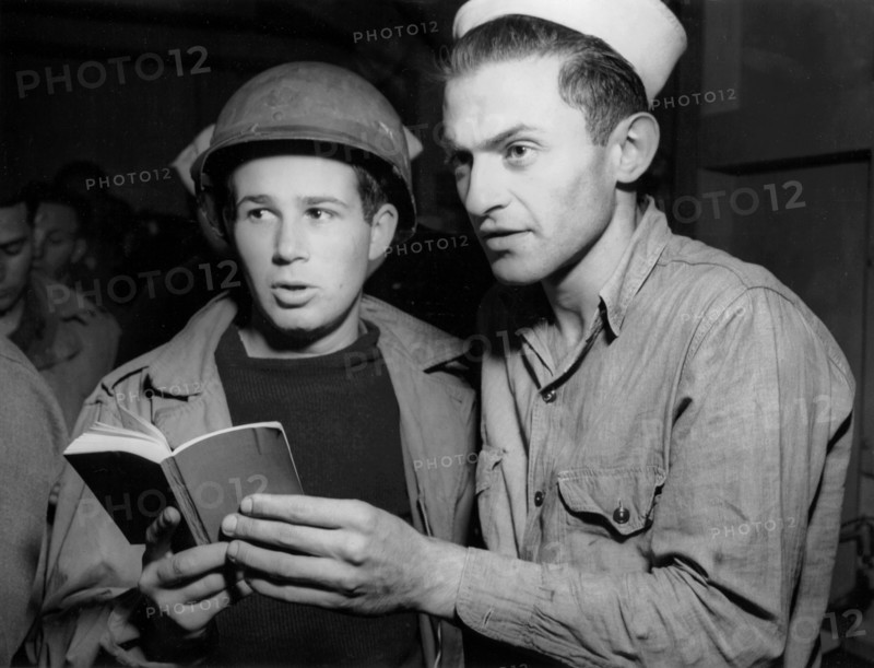 Two American sailors at Jewish service aboard boat in England, June 5, 1944