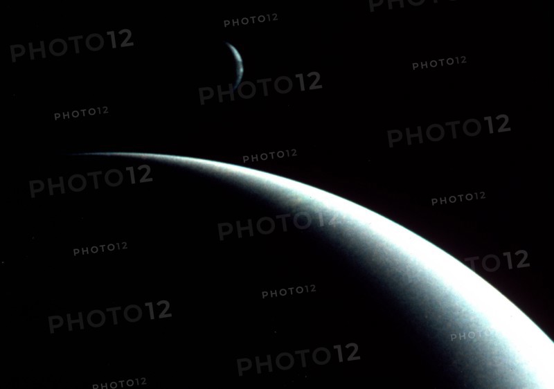 Crescents of Neptune and Triton by Voyager II spacecraft (August 29, 1989).