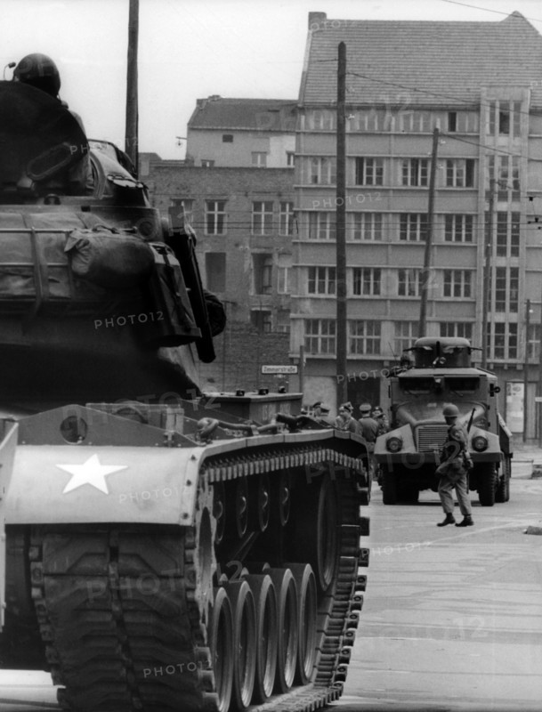 US tank and water-gun vehicle of the People's Police at checkpoint Friedrichstraße
