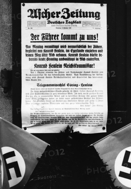 The image from the Nazi Propaganda! shows the newspaper of Asch of 2 October 1938 that announced the arrival of Adolf HItler in Asch on 3 October 1938, after the Munich Agreement of 29 September 1938. Photo: Fotoarchiv für Zeitgeschichte/Archiv || Mininum fee EUR 40