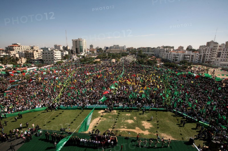 (111018) -- GAZA, Oct. 18, 2011 () -- Thousands of Palestinians attend the welcome ceremony held for the Palestinian prisoners released from Israel in al-Katiba Yard in Gaza City, Oct. 18, 2011. Israel and the Palestinians finished on Tuesday the first phase of a recently reached prisoner swap deal, which involves an Israeli soldier Gilad Shalit and 1,027 Palestinian and Arab prisoners, with the major swap deal site set at the Rafah border crossing between Egypt and the Gaza Strip. ()