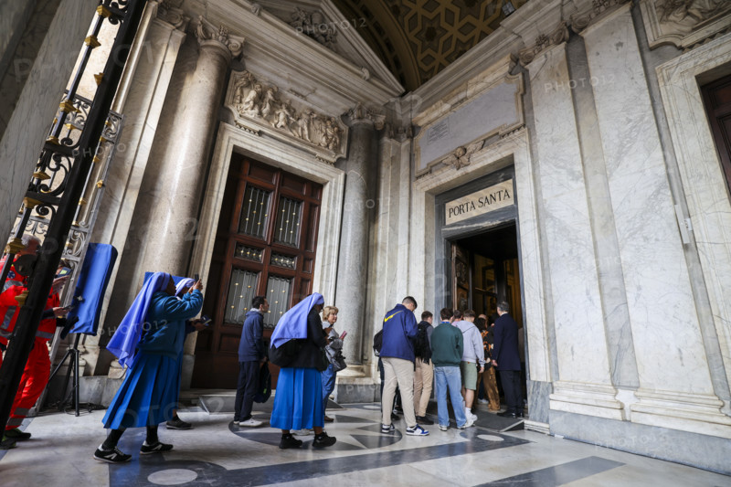 People enter the Basilica of Santa Maria Maggiore through the Holy Door.