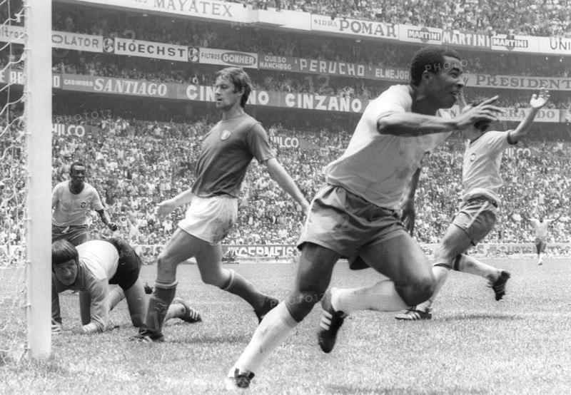 Brazilian international football player Jairzinho (front) is celebrating his 3:1 goal during the final match of the 1970 FIFA World Cup against Italy (4:1) on June 22nd 1970 in Mexico City. Goalkeeper Enrico Albertosi (on the ground) is left with nothing.