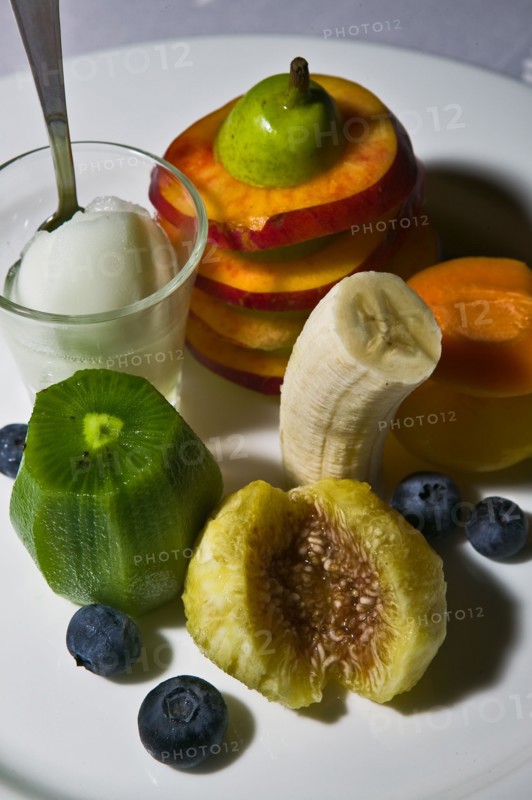 A dessert with fruit and icecream