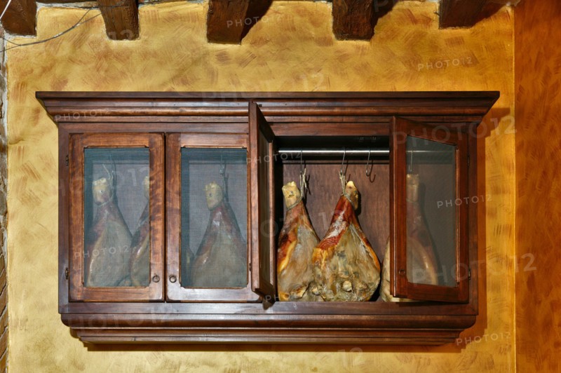 Cabinet showing prosciutto in Montefalco (PG), Umbria, Italia - Italy