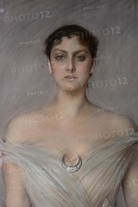 “Portrait of a lady in white with gloves and fan” by Giovanni Boldini