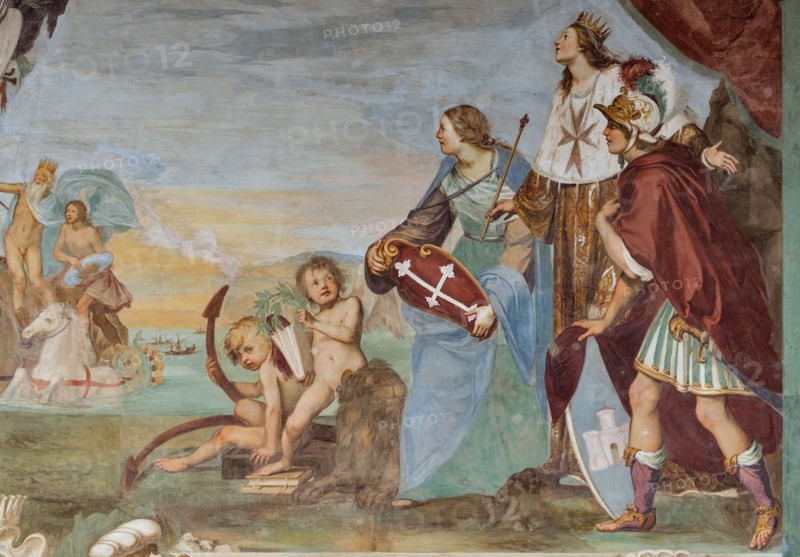 Medici Villa La Petraia, courtyard:“Dominance of Tuscany over the sea”, fresco from the cycle of the Fasti Medicei by Volterrano (Baldassarre Franceschini), 1636-1647.
The scene is set in Livorno, the Medici port and ideal city refounded by Francesco I de' Medici and his brother Ferdinand I, in the shadow of the monument of the Four Moors, with the statue of Ferdinand crowned by two winged victories. In the centre, in the background, Neptune's chariot proceeds, with Galatea and Perseus (holding Medusa's shield), to which the sea god points the statue. They sail among a large group of galleys of the Order of Saint Stephen.
On the right, in front of a cloth held up by putti in the face and under a personification of Fame, we see the allegories of Tuscany (with the crossed shield), of the Grand Duchy (with crown, scepter and mantle with the crest of the Order) and of Livorno, with the castle coat of arms.
Detail.
Villa medicea La Petraia, Firenze (FI) - Florence, Toscana - Tuscany, It...