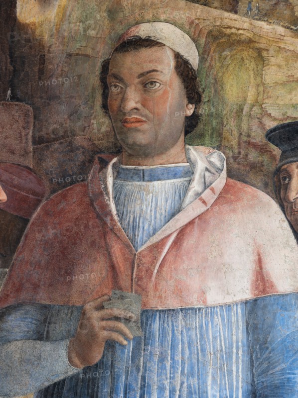 Ducal Palace: south-west wall of the “Bridal Chamber or Camera Picta", which is a room located in the north-east tower of the Castle of San Giorgio in Mantua. It is famous for the cycle of frescoes that covers its walls, a masterpiece by Andrea Mantegna, created between 1465 and 1474.
The wall, on the theme of “The Meeting” is divided into three sectors. In the one on the left the actual meeting takes place, in the central one some cherubs hold a dedicatory plaque and in the one on the right the marquis's court parades.
Detail of the right part of the wall with the portrait of Francesco Gonzaga Cardinal, Ludovico II’ son.
Palazzo Ducale, Mantova (MN) - Mantua, Lombardia - Lombardy, Italia - Italy