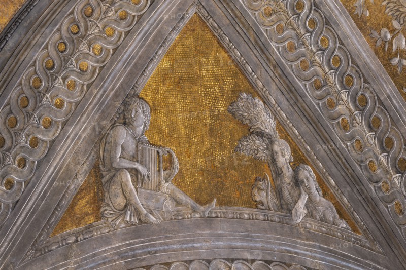 Ducal Palace: vault of the “Bridal Chamber or Camera Picta", which is a room located in the north-east tower of the Castle of San Giorgio in Mantua. It is famous for the cycle of frescoes that covers its walls, a masterpiece by Andrea Mantegna, created between 1465 and 1474.
Detail of the vault: “Orpheus enchants Cerberus and a Fury”, a pendentive decorated with a fake bas-relief of mythological inspiration, which symbolically celebrates the strength of the marquis as a leader and statesman.
Palazzo Ducale, Mantova (MN) - Mantua, Lombardia - Lombardy, Italia - Italy
