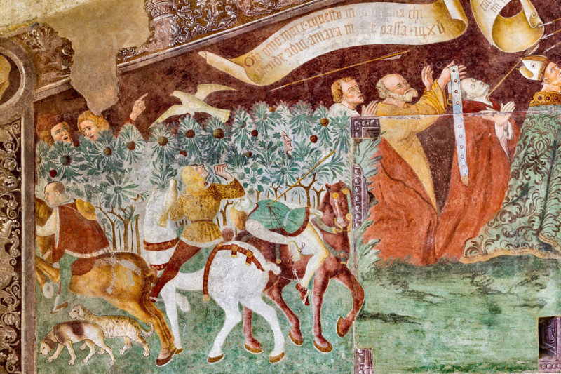 Clusone, Oratorio dei Disciplini o di San Bernardino, facciata: affreschi  "Trionfo della Morte" (parte alta) e "Danza Macabra" (parte bassa), 1485. Opera dell'artista clusonese Giacomo Borlone De Buschis.
Dettaglio del Trionfo della Morte: La Morte si trova sopra un sarcofago al cui interno si trovano ormai privi di vita il Papa e l’Imperatore con intorno serpenti, rospi e scorpioni (simboli di superbia e morte improvvisa). La Morte tiene in mando grossi cartigli che ricordano che  tutti sono destinati a lasciare il mondo terreno.

[ENG] 
Clusone, Oratory of Disciplini or St. Bernardino, façade: frescoes with the Triumph of Death on the top and a Dance of Death (Macabre Dance) in the lower register (1485). All the frescoes are by Giacomo Borlone De Buschis.
Detail of the Triumph of Death standing on a sarcophagus where the dead Pope and the Emperor lie. Theay are surrounded by serpents, scorpions and toads (symbols of pride and sudden death). Death hold big scrolls to remind ever...