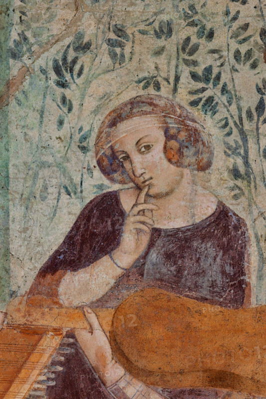 Pisa, Monumental Cemetery: "Triumph of Death," detail of the frescoes by Buonamico Buffalmacco, 1336/1341. On the left, a detail of the souls of plague victims being seized by devils. On the right, a detail of a courtly scene: "The Ten Youths in the Garden." Young woman.
Camposanto Monumentale, Pisa (PI), Toscana - Tuscany, Italia - Italy
