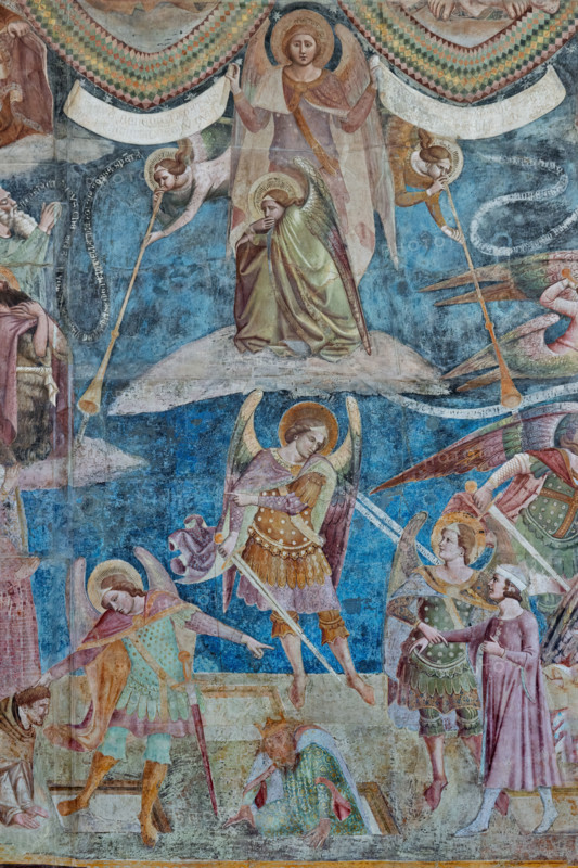 Pisa, Camposanto monumentale:
“Giudizio Universale”.  Affreschi di Buonamico Buffalmacco, 1336/1341.
Particolare con gruppo di angeli: due angeli suonatori di buccina, o tubicino), un terzo accovacciato che si chiude la bocca con una mano, e un quarto, ritto in piedi, che regge due cartigli; in quello di destra sta scritto: "venite benedicti patris mei, percipite regnum quod vobis paratum est"; in quello a sinistra: "ite maledicti in ignem aeternum qui paratus est a diabulo". 

[ENG]
Pisa, Monumental Cemetery: "The Last Judgement”. Frescoes by Buonamico Buffalmacco, 1336/1341.
Detail with a group of angels: two angels playing the tuba, a third crouching and covering his mouth with one hand, and a fourth standing, holding two cartouches; the one on the right reads: "Venite benedicti patris mei, percipite regnum quod vobis paratum est"; the one on the left reads: "ite maledicti in ignem aeternum qui paratus est a diabulo".
Camposanto Monumentale, Pisa (PI), Toscana - Tuscany, Ital...