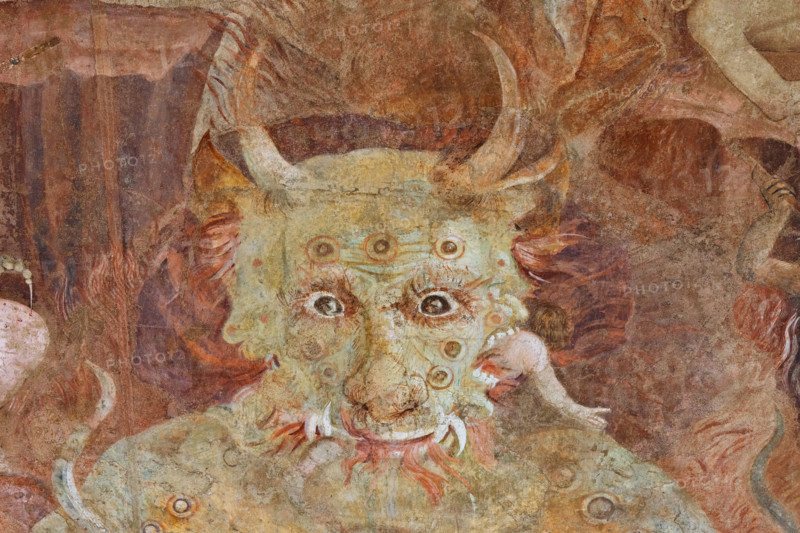 Pisa, Camposanto monumentale:
“Inferno”; particolare con “Lucifero", figura gigantesca, di dimensioni doppie rispetto al Cristo giudice. Lucifero rappresenta l'orgoglio, radice di tutti i vizi. Il dannato divorato da Lucifero è Giuda Iscariota, maciullato nella bocca centrale del mostro. Lucifero divora anche Bruto e Cassio nelle bocche laterali. Giuda è considerato il traditore supremo per aver tradito Cristo, mentre Bruto e Cassio tradirono Giulio Cesare, considerato un benefattore e simbolo dell'Impero.
Affreschi di Buonamico Bufalmacco, 1336/1341.

[ENG]
Pisa, Monumental Cemetery: “Hell”; detail with “Lucifer,” a gigantic figure twice the size of Christ the Judge. Lucifer represents pride, the root of all vice. The damned soul devoured by Lucifer is Judas Iscariot, mangled in the monster’s central mouth. Lucifer also devours Brutus and Cassius in the lateral mouths. Judas is considered the supreme traitor for betraying Christ, while Brutus and Cassius betrayed Julius Caesar, c...