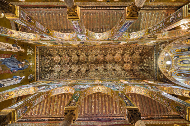 Palermo, The Royal Palace or Palazzo dei Normanni (Palace of the Normans), The Palatine Chapel (Basilica), central nave: wooden ceiling, created by Fatimid school masters and consisting of wooden coffers called muqarnas, painted with rare images (phytoform and zoomorphic ornaments, birds, fantastic and mythological animals, including human figures in hunting, making war and love, players, dancers and belly dancers, chess players: These figures are generally prohibited by the Muslim tradition) and Cufic inscriptions (1143).
Palazzo Reale (Palazzo dei Norma, Palermo (PA), Sicilia - Sicily, Italia - Italy