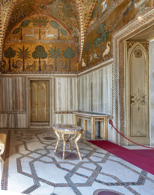 Palermo, The Royal Palace or Palazzo dei Normanni (Palace of the Normans), Pisana Tower, the King Roger Room: view of the Room which was commissioned by King Roger II d'Altavilla. It is characterized by large mosaic surfaces of great value representing plant elements (palms and banana trees) and scenes of courtly and hunting style, symbols of the Norman power (hunting scenes with archers and deer, peacocks, swans, and mythological centaurs, griffins and other exotic animals including leopards and tigers among luxuriant vegetation). Mosaics are characterised by Greek Byzantiene style (XIII century).
Palazzo Reale (Palazzo dei Norma, Palermo (PA), Sicilia - Sicily, Italia - Italy