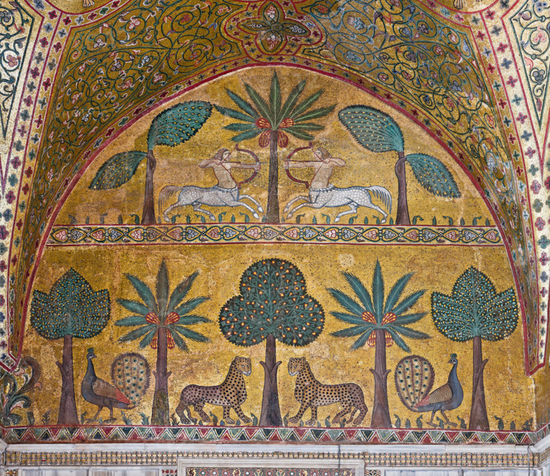 Palermo, The Royal Palace or Palazzo dei Normanni (Palace of the Normans), Pisana Tower, the King Roger Room: view of the Room which was commissioned by King Roger II d'Altavilla. It is characterized by large mosaic surfaces of great value representing plant elements and scenes of courtly and hunting style, symbols of the Norman power (hunting scenes with archers and deer, peacocks, swans, and mythological centaurs, griffins and other exotic animals among luxuriant vegetation). Mosaics are characterised by Greek Byzantine style (XIII century).
Detail with centaurs, peacocks, leopards and palm and banana trees.
Palazzo Reale (Palazzo dei Norma, Palermo (PA), Sicilia - Sicily, Italia - Italy