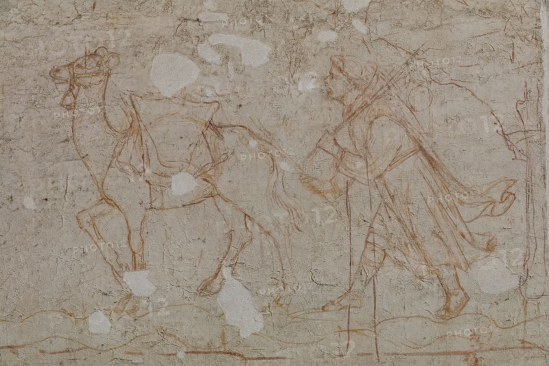 Pisa, Museo delle sinopie: “Tebaide”,
storie degli Eremiti e dei Santi Padri ispirate alla “Vitae Patrum” del canonico domenicano Cavalca. Sinopia preparatoria agli affreschi del Camposanto di Buonamico Buffalmacco, 1336/1341. Particolare di un monaco che si avvicina alla porta della città con un cammello carico. 

[ENG]
Pisa, Sinopia Museum: “Thebaid”, Stories of the Hermits and the Holy Fathers inspired by the Vitae Patrum by the Dominican Domenico Canon Cavalca. Sinopia preparatory to the frescoes by Buonamico Buffalmacco, 1336/1341. 
Detail of a monk approaching the city gate with a loaded camel.
Museo delle sinopie, Pisa (PI), Toscana - Tuscany, Italia - Italy