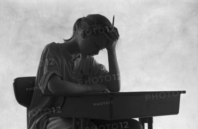 Pensive Student at Desk