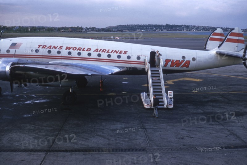 Stewardess Standing at top of Stairs of TWA Airplane, Circa 1950's