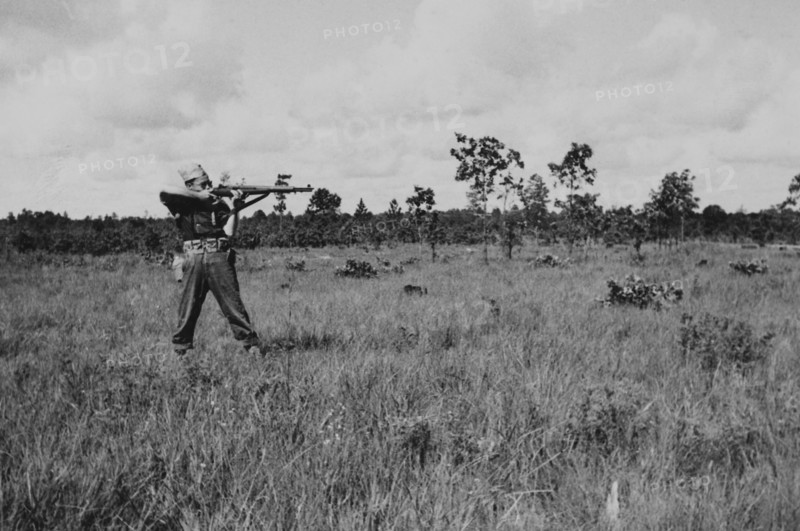 Soldier Displaying Proper Shooting Position in Field During Training Session, WWII, 2nd Battalion, 389th Infantry, US Army Military Base Indiana, USA, 1942